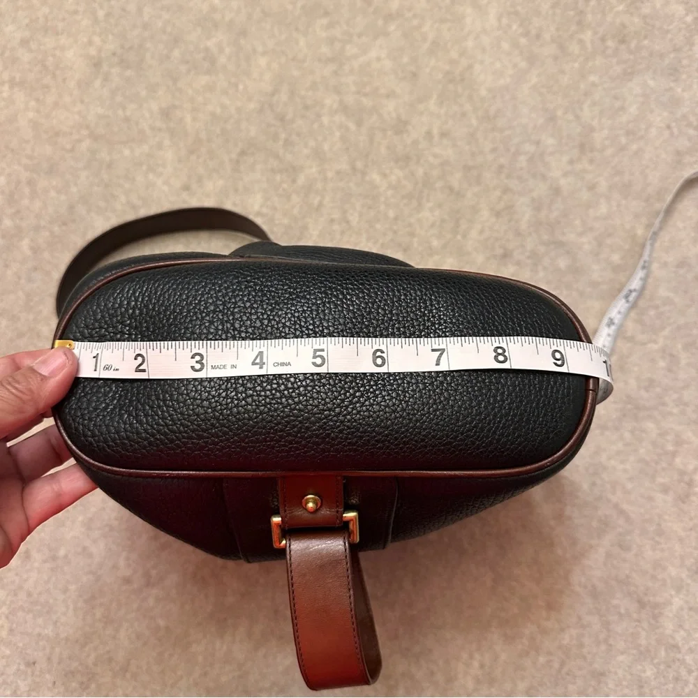 Vintage Dooney & Bourke Black w/Brown All Weather Leather Sling Small Backpack